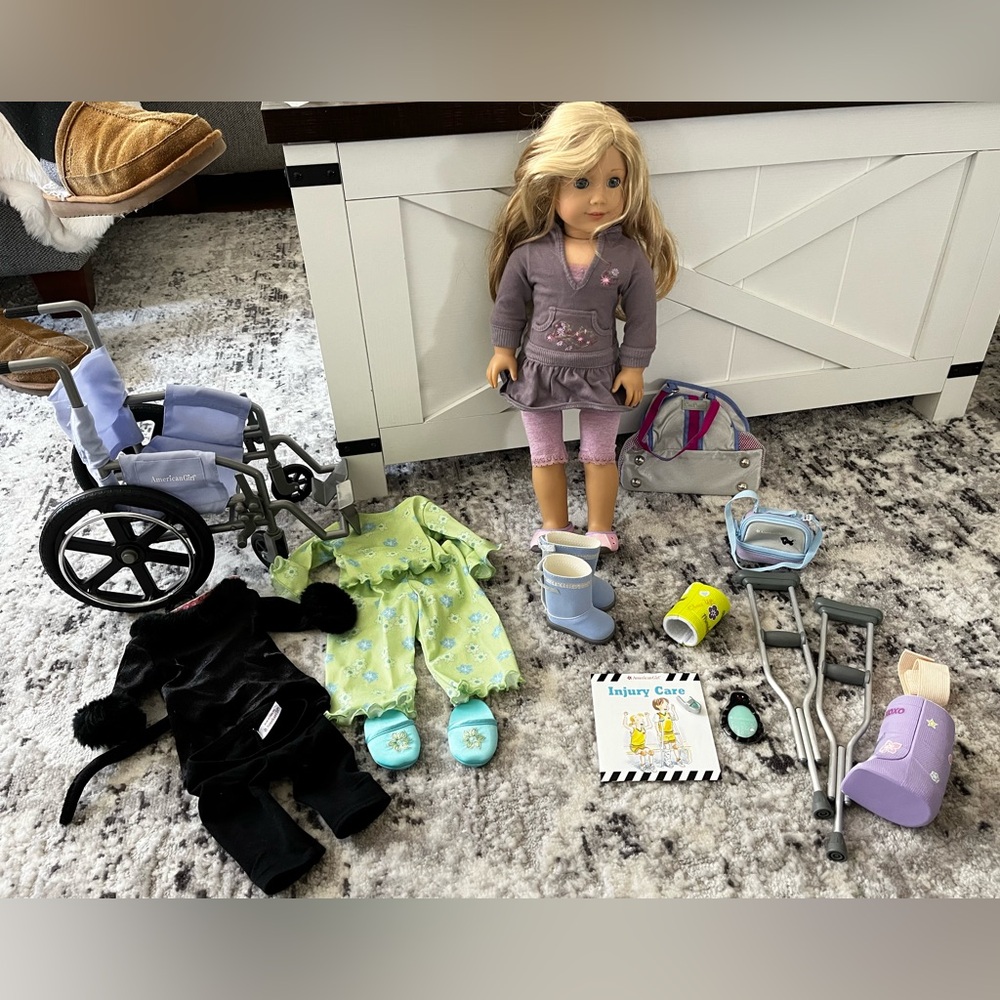 American girl doll with wheel chair, injury kit accessories, two outfits & more